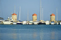 DG383178. Windmills at the port. Rhodes. Greece. 19.10.2022.