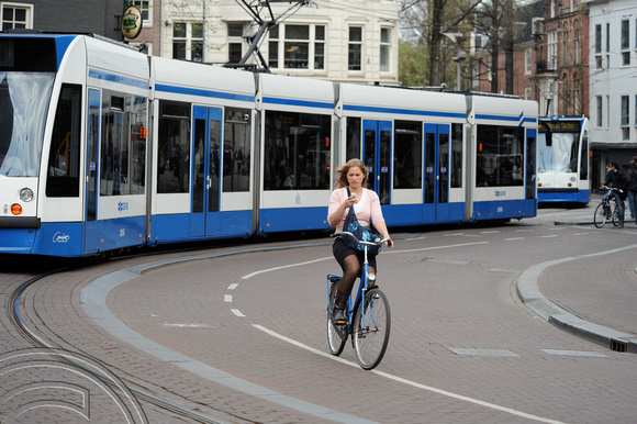 FDG06834. Tram & cyclist. Spui. Amsterdam Centraal. Holland. 29.4.08.