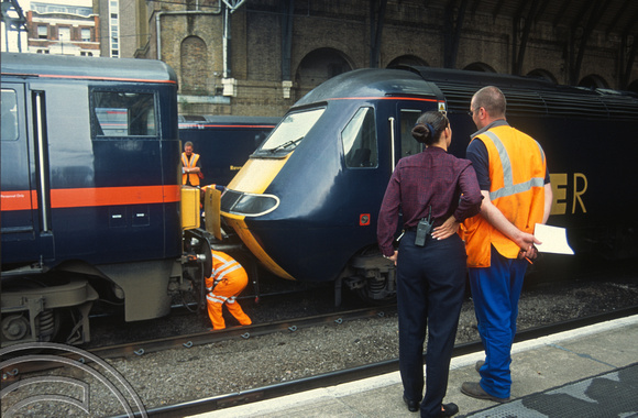 12384. 91129. Staff watch the 91attaching to 43120 to work the 16.00 KX - Aberdeen. 16.07.03
