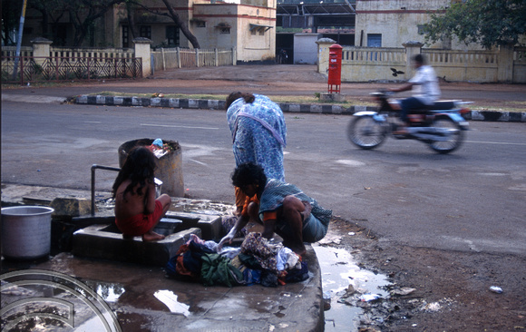 T6576. Street family washing. Pondicherry. Tamil Nadu India. 28th January 1998
