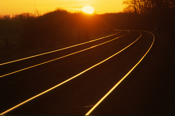 21036. Sunset along the tracks at Washstones level crossing. 13.2.01
