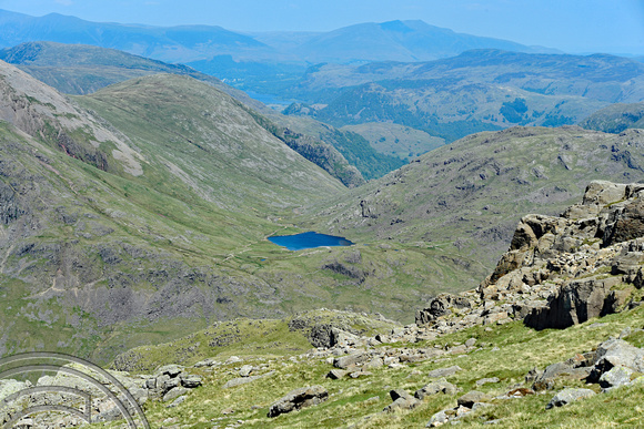 DG270989. Angle Tarn seen from the top of Scafell. Wasdale. Cumbia. England. 26.5.17