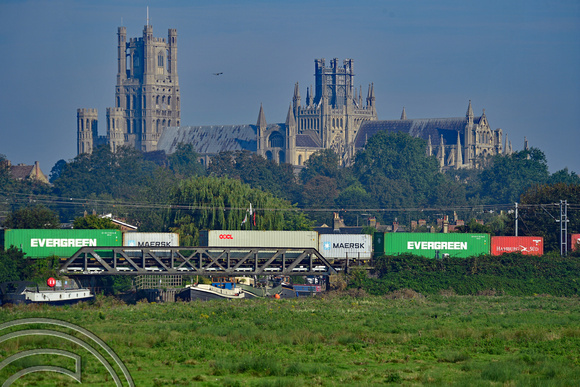 DG401827. Intermodal passes the cathedral. Ely. 7.9.2023.