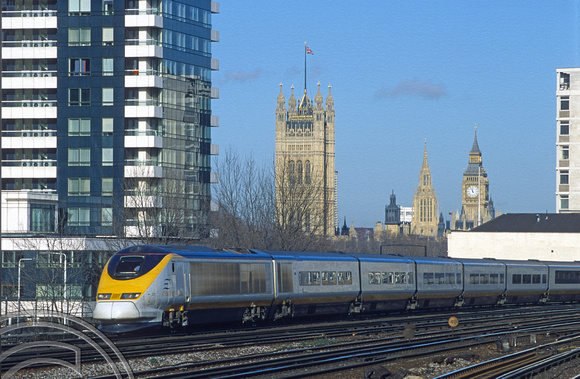 08736. 3211. Eurostar with Parliament in the background. Vauxhall. 25.1.01