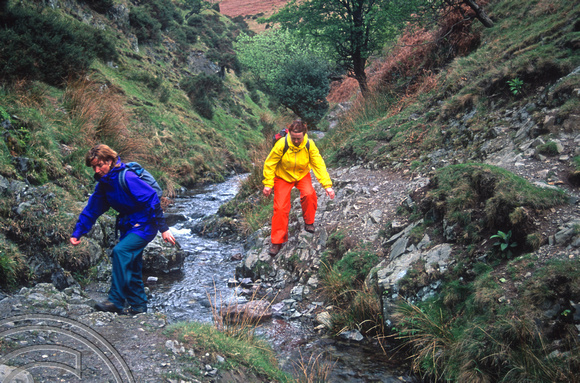 T15448.Lynn and Karen negotiate a steep path on the Long Mynd. Shropshire. 03.05.2003