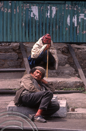 T6961. Old man lounging at the station. Kurseong. West Bengal. India. April.1998.