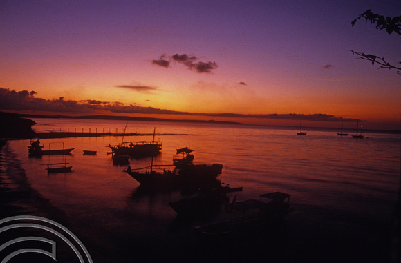 T04129. Sunset over the harbour. Semau Island. Timor. Indonesia. 14th September 1992