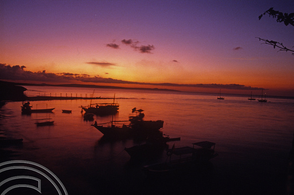 T04130. Sunset over the harbour. Semau Island. Timor. Indonesia. 14th September 1992