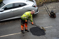 DG412218. Fixing potholes. Scarr Bottom Rd. Halifax. West Yorkshire. 7.3.2024.