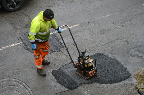 DG412234. Fixing potholes. Scarr Bottom Rd. Halifax. West Yorkshire. 7.3.2024.