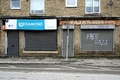DG413701. Grafitti on closed shops. Calder Rd. Ravensthorpe. West Yorkshire. 3.4.2024.