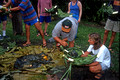 T9150. Removing the food from the fire pit. Rarotonga. Cook Islands. March 1999