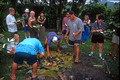 T9151. Removing the food from the fire pit. Rarotonga. Cook Islands. March 1999
