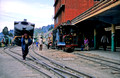 TR6607. Porter and train. Darjeeling. India.  April 1998.