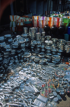 T5630. Stainless steel kitchen kit for sale in the market. Mapusa. Goa. India. December 1995