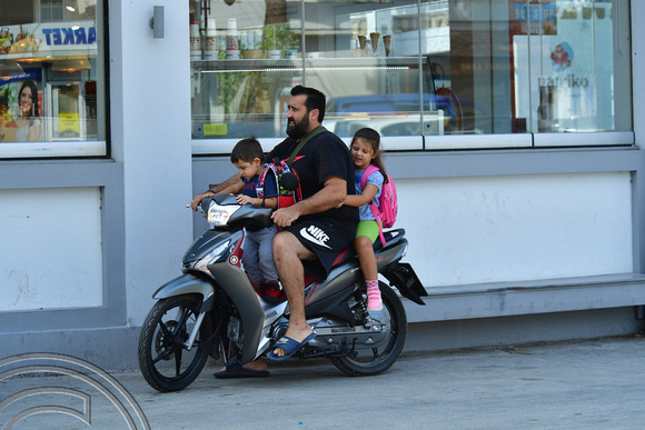 DG383017. Family on a scooter. Lardos. Rhodes. Greece. 18.10.2022.
