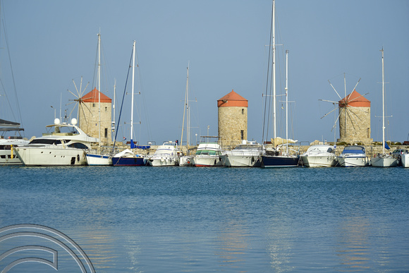 DG383178. Windmills at the port. Rhodes. Greece. 19.10.2022.