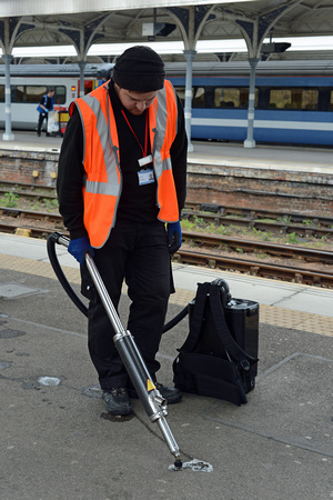 DG212807. Cleaning chewing gum from the platform. Norwich. 1.5.15