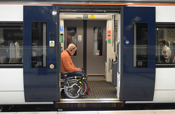 DG213039. Cyclist on the train. Liverpool St. 1.5.15