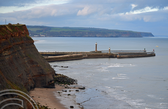 DG383773. Cliffs and breakwater. Whitby. North Yorkshire. 12.11.2022.