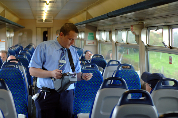 DG12824. Northern Conductor checking tickets. 26.9.07.