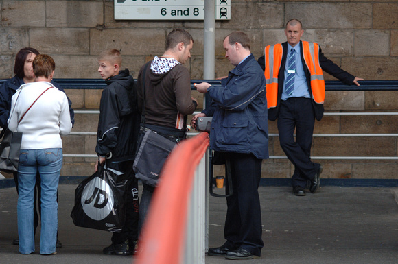 DG12393. Checking tickets. Newcastle upon Tyne. 13.9.07.