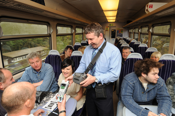 DG19471. Selling tickets on a Northern train in Yorkshire. 25.10.08.