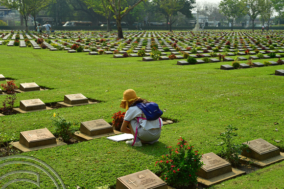 DG388677. Child recording soldiers details. War cemetery. Kanchanaburi. Thailand. 3.2.2023.