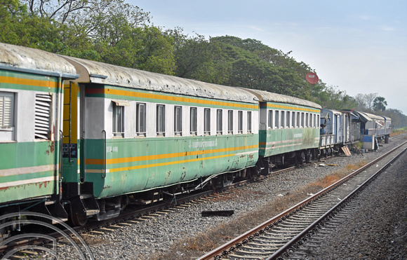 DG389080. Old coaches and wagons used as a works base. Ton Samrong. Thailand. 10.2.2023.