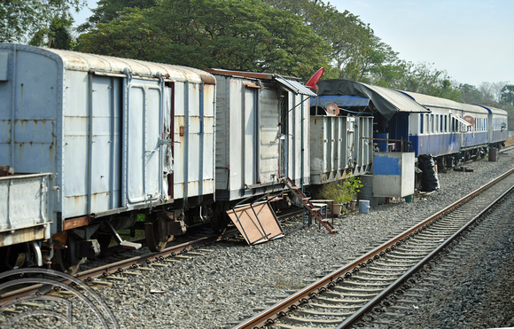 DG389082. Old coaches and wagons used as a works base. Ton Samrong. Thailand. 10.2.2023.
