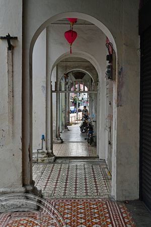DG389392. Old tiles outside empty shophouses. Love Lane. Georgetown. Penang. Malaysia. 15.2.2023.