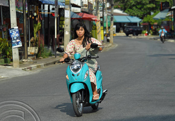 DG388785. Scooter rider. Kanchaburi. Thailand. 6.2.2023.