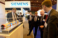 DG146732. Simon Burns MP at Siemens stand. Railtex 2013. London. 30.4.13.