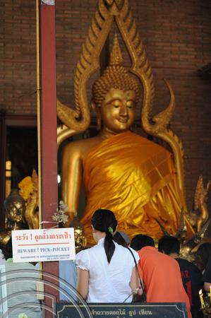 TD10055. Buddha & sad sign. Wat Yai Chai Mongkol. Ayutthaya. Thailand. 18.1.09.