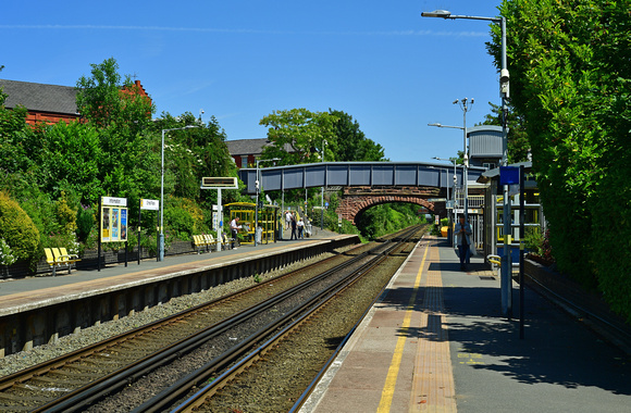 DG395635. Station platforms and garden.  Orrell Park. 3.6.2023.