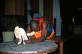 T10823. Acrobat squeezing through a hoop. Dar-es-Salaam. Tanzania. Africa. 13.05.01