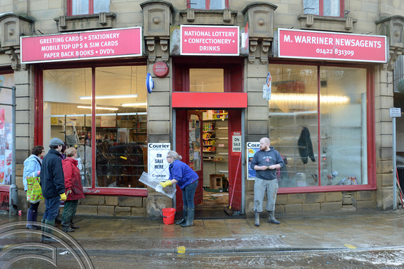 DG236860. Shopkeepers clearing up after the flood. Sowerby Bridge. W Yorks. 27.12.15.