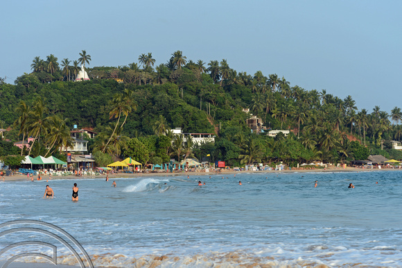 DG238521. Playing in the  waves. The long beach. Mirissa. Sri Lanka. 28.1.16