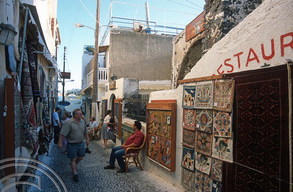 T11993. Selling goods in the street. Fira. Santorini. Cyclades. Greece. 27.9.01