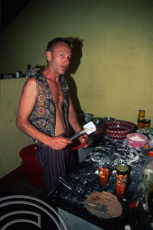 T6036. Forrest making pizza at Axel and Lucie's place. Arambol. Goa. India. December 1997