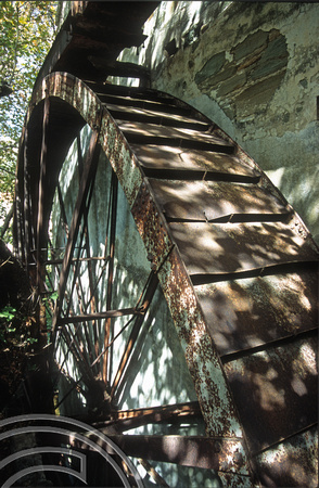 T14249. Water wheel on an abandoned pasta factory. Stenies. Andros. Cyclades. Greece. 25.9.02
