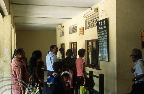 T14427. Passengers queuing for tickets at the railway station. Matara. Sri Lanka. 28.12.02