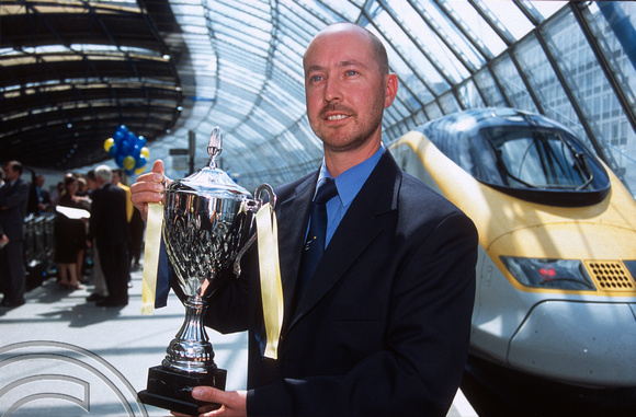 12676. Driver Alan Pears with the trophy. Waterloo International. 30.7.03