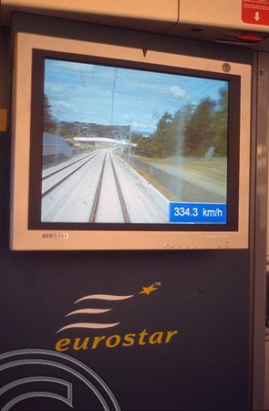 12650. TV screen shows the view from the cab and the speed - 334.3kph. HS1. 30.7.03