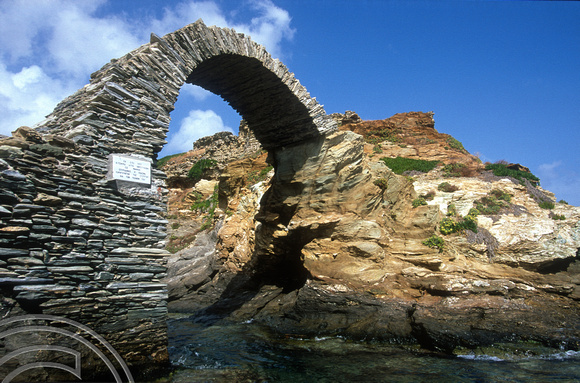 T14202. The ruined bridge which connects the Venetian castle to the town. Hora Andros. Cyclades. Greece. 24.09.02