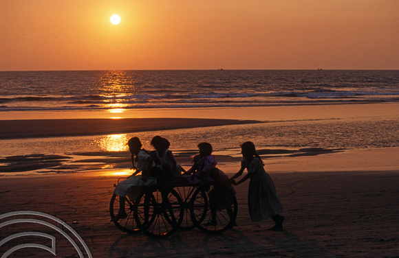 T6088. Girls playing on the beach at sunset. Arambol. Goa. India. December 1997