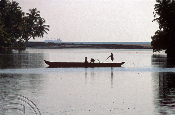 T6343. Ferrying a cyclist across a canal in the backwaters. Kerala. India. 29.12.1997