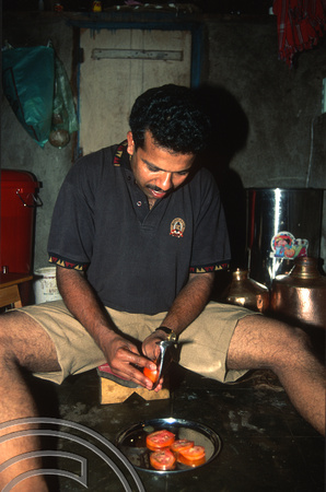 T6004. Anand Gawade preparing food at home. Mapusa. Goa. India. November 1997