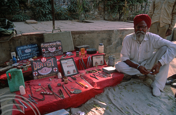 FR1798. Mr Gurbachan Singh. Street dentist. Outside the railway station. Jaipur. Rajasthan. India. 30.10.91