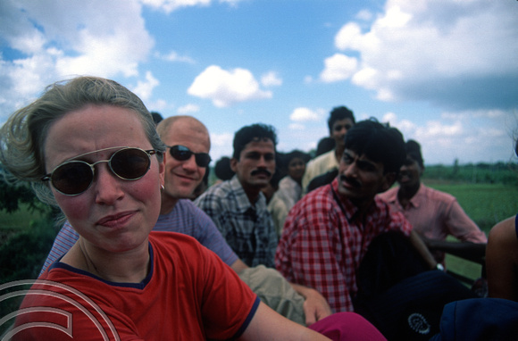 T6161. John and Helen on the roof of a bus to Hampi from Hospet. Karnataka. India. December.1997